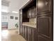 The dining room showcases custom dark wood cabinetry, granite countertops, and ample storage space for entertaining at 1978 E Carver Rd, Tempe, AZ 85284
