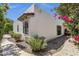 Stucco home featuring desert landscaping, trimmed windows, and unique architectural details at 1978 E Carver Rd, Tempe, AZ 85284
