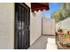 Private outdoor area with a security door, shed and space for gardening and potted plants at 1978 E Carver Rd, Tempe, AZ 85284