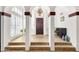 Stately foyer with columns, tile floors, and a decorative chandelier at 1978 E Carver Rd, Tempe, AZ 85284