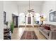 Open-concept living room with tile floors, columns, and plenty of natural light at 1978 E Carver Rd, Tempe, AZ 85284