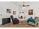 A stylish living room boasts a unique fireplace, cozy seating, and elegant decor, creating a welcoming atmosphere at 1978 E Carver Rd, Tempe, AZ 85284