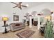 Spacious living room with tile floors, columns, and a comfortable seating area at 1978 E Carver Rd, Tempe, AZ 85284