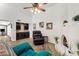 Living room with tile floor, fireplace, wet bar and comfortable chair at 1978 E Carver Rd, Tempe, AZ 85284