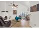 Living room featuring a fireplace, comfortable seating and a dining area at 1978 E Carver Rd, Tempe, AZ 85284