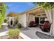 Relaxing covered patio with comfortable seating, a fire pit, and views of the surrounding yard at 1978 E Carver Rd, Tempe, AZ 85284