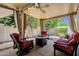 Inviting covered patio featuring comfortable seating, a cozy fire pit, and views of the private yard at 1978 E Carver Rd, Tempe, AZ 85284