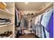 This walk-in closet provides ample shelving and storage space to keep your wardrobe organized and accessible at 1978 E Carver Rd, Tempe, AZ 85284