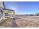 A spacious backyard features a covered patio and ample space for outdoor activities and landscaping at 3033 N 367Th Ave, Tonopah, AZ 85354
