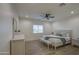 Bright bedroom with neutral tones and a ceiling fan, showcasing a serene atmosphere at 3033 N 367Th Ave, Tonopah, AZ 85354