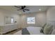 Bright bedroom featuring wood-look floors, neutral décor, and comfortable furnishings at 3033 N 367Th Ave, Tonopah, AZ 85354