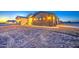 View of the side of the single-story home with garage and hose at 3033 N 367Th Ave, Tonopah, AZ 85354