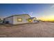 View of the back of the single-story home with white pillars at 3033 N 367Th Ave, Tonopah, AZ 85354