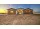 Charming single-story home featuring a combination of white and brown paneling under a twilight sky at 3033 N 367Th Ave, Tonopah, AZ 85354