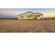 View of the back of the single-story home at 3033 N 367Th Ave, Tonopah, AZ 85354