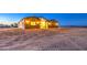 Exterior view of a well-maintained single-story home with a welcoming entrance and desert landscaping at 3033 N 367Th Ave, Tonopah, AZ 85354