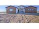 Charming single-story home featuring a low-pitched roof, a landscaped yard, and a welcoming front entrance at 3033 N 367Th Ave, Tonopah, AZ 85354