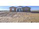 Beautiful home with earth tone exterior and minimalist desert landscaping at 3033 N 367Th Ave, Tonopah, AZ 85354