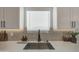 Modern kitchen sink with a view, stylish faucet, and ample counter space at 3033 N 367Th Ave, Tonopah, AZ 85354