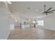 Spacious open concept area featuring wood-look floors, modern recessed lighting and integrated kitchen at 3033 N 367Th Ave, Tonopah, AZ 85354
