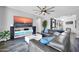 Modern living room with large sectional sofa, big-screen TV, and contemporary decor at 3713 W Abrams Dr, New River, AZ 85087