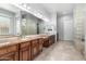 Dual sink bathroom with lots of counterspace, custom cabinets, and decorative lighting at 3931 E Fox Cir, Mesa, AZ 85205