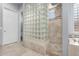 Well-lit bathroom showcases glass block shower, walk-in shower, and tiled floor, along with a separate toilet at 3931 E Fox Cir, Mesa, AZ 85205