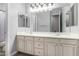 Traditional bathroom features a double sink vanity and a large mirror at 3931 E Fox Cir, Mesa, AZ 85205