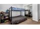 Bedroom showcases bunk bed, built-in shelves, and mirrored closet doors, creating a cozy, functional space at 3931 E Fox Cir, Mesa, AZ 85205