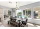 Bright dining area with views of the outdoor pool and patio, ideal for Gathering gatherings at 3931 E Fox Cir, Mesa, AZ 85205