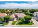 Beautiful home with mature landscaping, a brick walkway and a well-manicured lawn at 3931 E Fox Cir, Mesa, AZ 85205