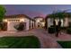 Charming single-story home featuring well-manicured landscaping, a three-car garage and a beautiful brick driveway at 3931 E Fox Cir, Mesa, AZ 85205