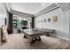 Bright game room with a ping pong and shuffleboard table, large windows, and recessed lighting at 3931 E Fox Cir, Mesa, AZ 85205