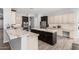 Spacious kitchen featuring granite counters, stainless steel appliances, and a large center island at 3931 E Fox Cir, Mesa, AZ 85205