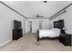 Relaxing bedroom features neutral tones, soft carpet, and a ceiling fan for ultimate comfort at 3931 E Fox Cir, Mesa, AZ 85205
