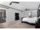 Large main bedroom with a ceiling fan, carpet, and access to an ensuite bathroom and walk-in closet at 3931 E Fox Cir, Mesa, AZ 85205