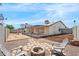 Relaxing backyard features a fire pit, swing set, and patio for outdoor enjoyment at 4631 N 77Th Dr, Phoenix, AZ 85033