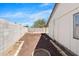 Well-maintained backyard featuring a mulch garden bed and stone walkway, perfect for landscaping at 4631 N 77Th Dr, Phoenix, AZ 85033