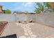 Cozy backyard seating area with a charming stone fire pit, perfect for gathering at 4631 N 77Th Dr, Phoenix, AZ 85033