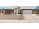 Charming single-story home featuring a brick facade, two-car garage, and well-maintained front yard at 4631 N 77Th Dr, Phoenix, AZ 85033