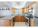 Updated kitchen with stainless steel appliances, granite countertops, and stylish cabinetry at 4631 N 77Th Dr, Phoenix, AZ 85033