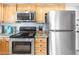 Well-equipped kitchen features stainless steel appliances and stylish countertops at 4631 N 77Th Dr, Phoenix, AZ 85033