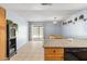 Spacious eat-in kitchen with granite counters, oak cabinets, and sliding door to patio at 4631 N 77Th Dr, Phoenix, AZ 85033