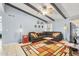 Spacious living room with vaulted ceilings and a comfortable sectional sofa, perfect for relaxation at 4631 N 77Th Dr, Phoenix, AZ 85033