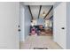 View from the doorway of a cozy living room featuring vaulted ceilings and tile flooring at 4631 N 77Th Dr, Phoenix, AZ 85033