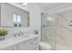Modern bathroom featuring a sleek vanity, a large mirror, and a luxurious glass-enclosed shower at 5315 S River Dr, Tempe, AZ 85283