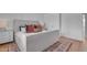 Comfortable bedroom with a padded headboard and a neutral color scheme at 5315 S River Dr, Tempe, AZ 85283