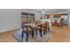 Inviting dining area with a wood table, slider door and seating for six at 5315 S River Dr, Tempe, AZ 85283