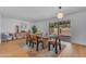 Open-concept dining area with a table for six and access to the backyard at 5315 S River Dr, Tempe, AZ 85283