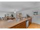 Open kitchen with wood cabinets, quartz countertops, and easy access to the dining room at 5315 S River Dr, Tempe, AZ 85283